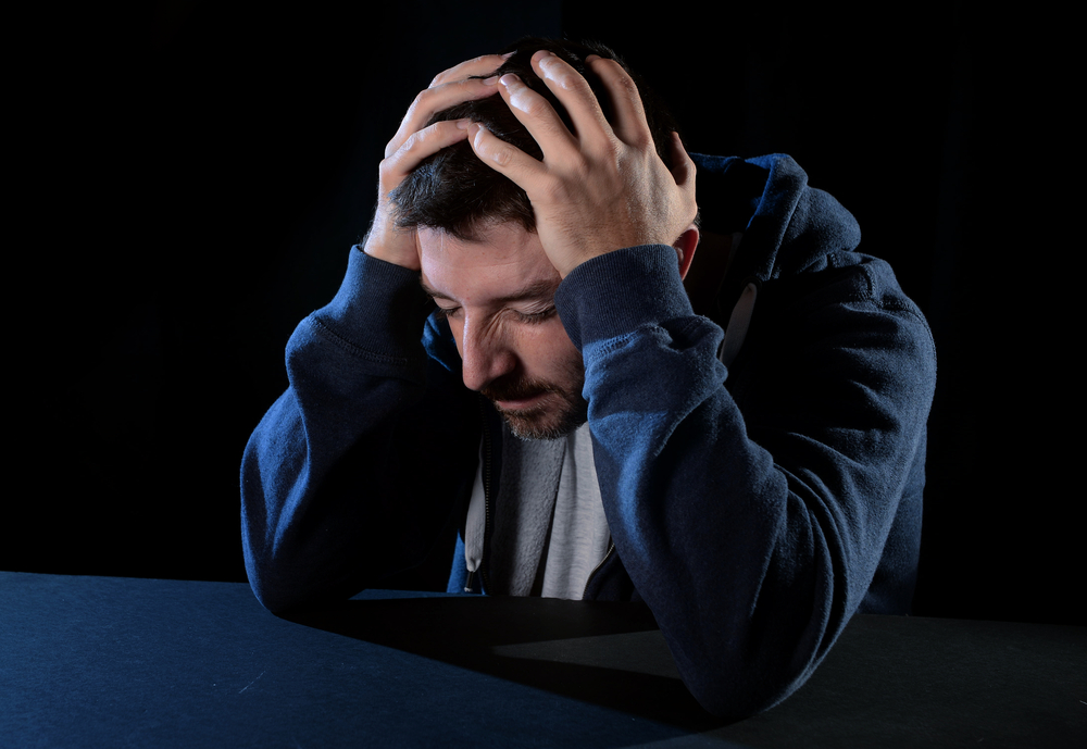 desperate man suffering emotional pain, grief and deep depression